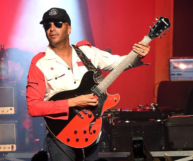 Tom Morello Premiered a New Solo Song Called “Keep Going” On an Intercept Podcast Featuring Julian Assange